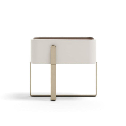 Modern side table with white lampshade and gold base on a white background
